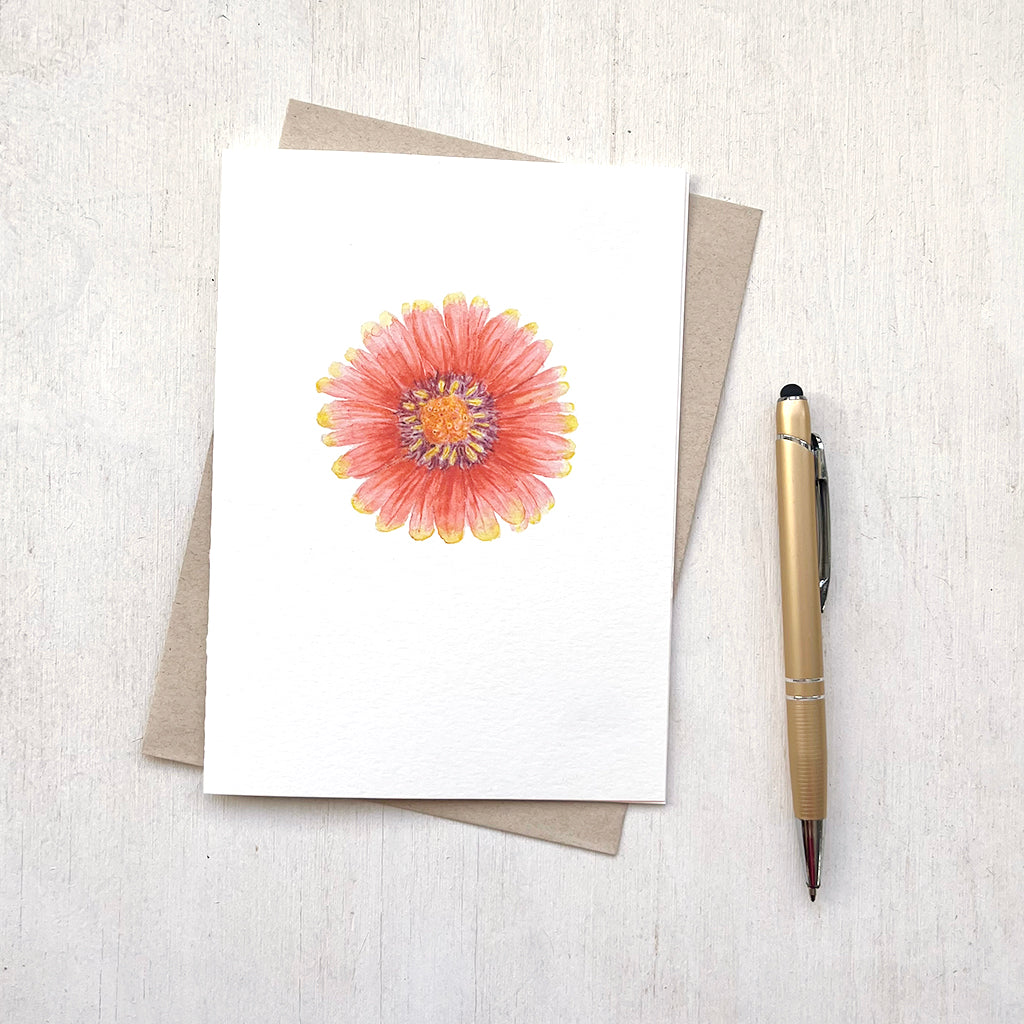 A note card featuring a red and yellow gaillardia flower. Watercolour painting by Kathleen Maunder.