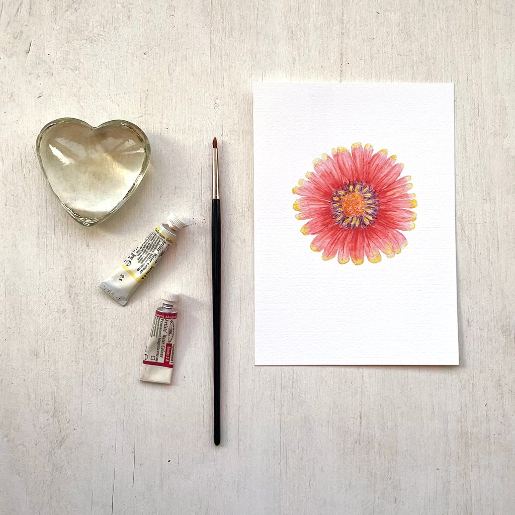 An art print featuring a watercolor painting of a red and yellow gaillardia flower.